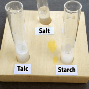 Photo of the results of adding water to salt, talc, and starch samples