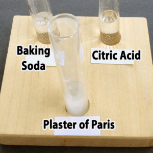 Photo of the results of adding water to baking soda, citric acid, and plaster of Paris samples