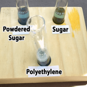 Photo of the results of adding one drop of bromothymol blue to powdered sugar, granulated sugar, and polyethylene samples