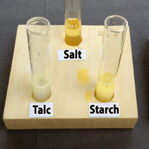 Photo of the results of adding one drop of vinegar to salt, talc, and starch samples