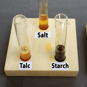 Photo of the results of adding one drop of iodine to salt, talc, and starch samples