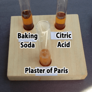 Photo of the results of adding one drop of iodine to baking soda, citric acid, and plaster of Paris samples
