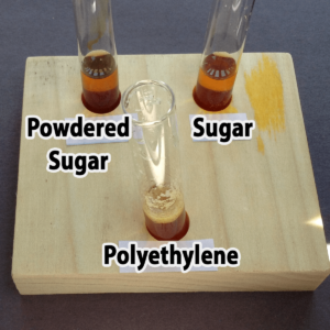Photo of the results of adding one drop of iodine to powdered sugar, granulated sugar, and polyethylene samples